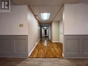 Georgina (Keswick South) apartment for rent - A long hallway with wood floors and white walls.