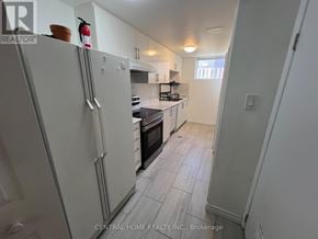 Georgina (Keswick South) apartment for rent - A kitchen with white appliances and a white refrigerator.