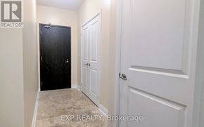 Toronto (Annex) condo for rent - A hallway with a black door and a white door.