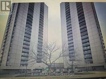 London East (East K) condo for rent - A tall building with a tree in front of it.