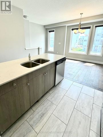 London East (East D) townhouse for rent - A kitchen with a sink and a window.