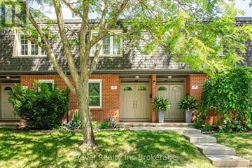 London North (North F) townhouse for rent - A house with a tree in front of it.