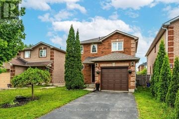 Barrie (Georgian Drive) apartment for rent - A house with a brown garage door is for sale.