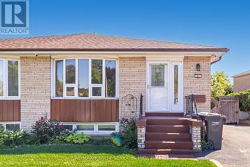 Brampton (Avondale) apartment for rent - A house with a brown front door and a white window.