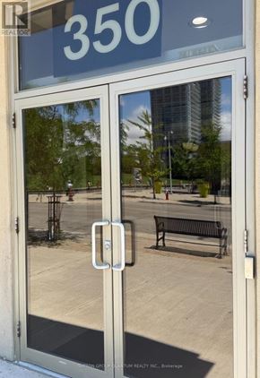 Mississauga (City Centre) condo for rent - The door has a glass window and a handle.