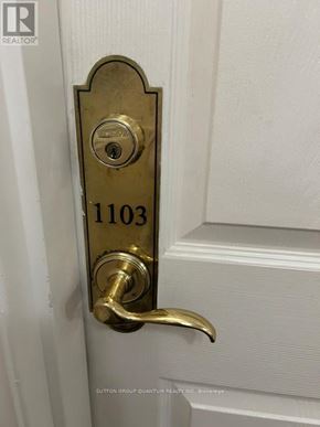 Mississauga (City Centre) condo for rent - A door handle with a lock and a number 1103 on it.