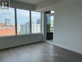 Toronto (South Parkdale) condo for rent - A realtor photo of a room with a view of the city.