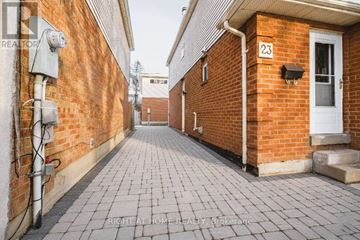 Ajax (Central West) apartment for rent - A brick building with the number 23 on the door.