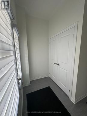 Thorold (Rolling Meadows) townhouse for rent - A white door with a black mat in front of it.