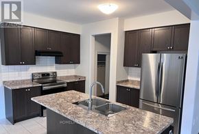 Niagara Falls (Brown) apartment for rent - A kitchen with granite countertops and stainless steel appliances.