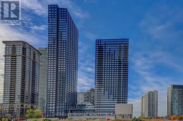 Mississauga (City Centre) condo for rent - A cityscape with tall buildings and a clear sky.