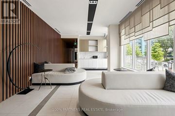 Toronto (Willowdale East) condo for rent - A modern living room with a white sofa and a wooden wall.