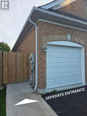 Oshawa (Pinecrest) apartment for rent - A brick house with a seperate entrance and a sign that says seperate entrance.