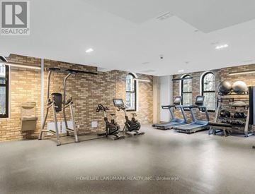 Toronto (Church-Yonge Corridor) condo for rent - A gym with a brick wall and various exercise equipment.
