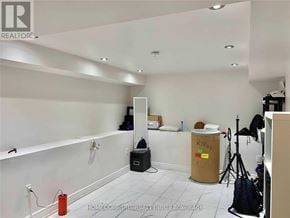Toronto (Willowridge-Martingrove-Richview) apartment for rent - A room with white walls and a white floor with a red fire extinguisher on the floor.
