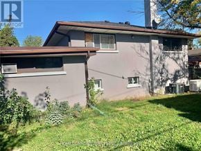 Toronto (Willowridge-Martingrove-Richview) apartment for rent - A house with a grey exterior and a brown roof.