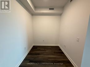 Vaughan (Vaughan Corporate Centre) condo for rent - A room with white walls and a wooden floor.