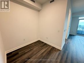 Vaughan (Vaughan Corporate Centre) condo for rent - A room with wood flooring and white walls.
