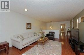 Toronto (Hillcrest Village) apartment for rent - A living room with a white couch and a coffee table.