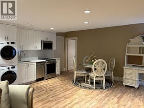 Vancouver apartment for rent - A kitchen with a table and chairs in the middle of the room.