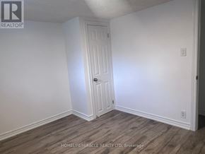 Toronto (Ionview) apartment for rent - A room with a door and a light switch on the wall.