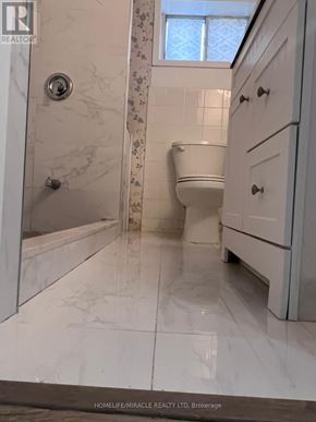 Toronto (Ionview) apartment for rent - A bathroom with a toilet, sink, and shower.