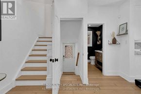 Mississauga (Lisgar) apartment for rent - A white hallway with a staircase and a doorway leading to a bathroom.