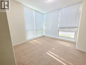 Coquitlam apartment for rent - A room with a carpeted floor and a window with blinds.
