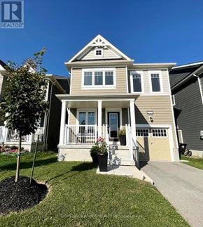Wasaga Beach apartment for rent - A house with a well-maintained lawn and a clear blue sky.