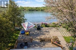 Alderville First Nation apartment for rent - A Coors beer tent is set up on a patio overlooking a lake.