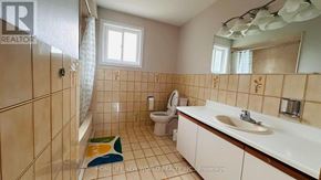 Richmond Hill (South Richvale) apartment for rent - A bathroom with a toilet, sink, and shower.
