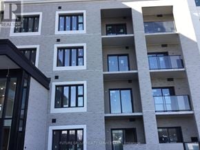 Milton (Wi Willmott) condo for rent - A building with the words "Future Group Realty Service Stop, Brokerage" written on it.