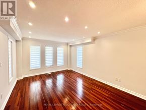 Vaughan (Vellore Village) apartment for rent - A room with wooden floors and white walls.
