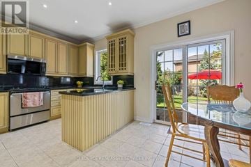 Oakville (Wm Westmount) apartment for rent - A kitchen with wooden cabinets and a black countertop.