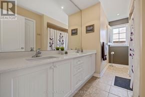Oakville (Wm Westmount) apartment for rent - A bathroom with a double sink vanity and a towel rack.