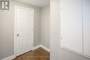 Brampton (Northwest Brampton) apartment for rent - A white door is in a room with a wooden floor.