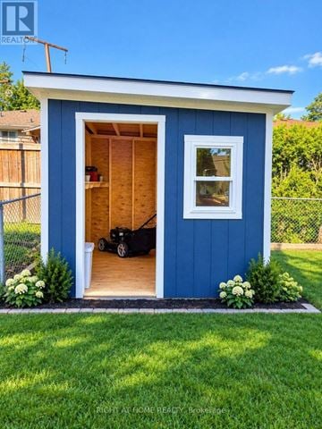 Hamilton (Mountview) apartment for rent - A blue shed with a black lawn mower inside.