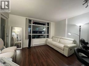 Vancouver apartment for rent - A living room with a white couch and a black chair.
