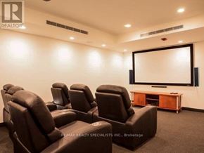 Toronto (Downsview-Roding-Cfb) condo for rent - A home theater room with a row of black leather chairs and a large screen.