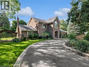 Ancaster apartment for rent - A large house with a driveway in front of it.