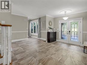 Ancaster apartment for rent - A spacious room with a tiled floor and a staircase on the left.