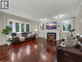 Ancaster apartment for rent - A living room with a fireplace and a couch.