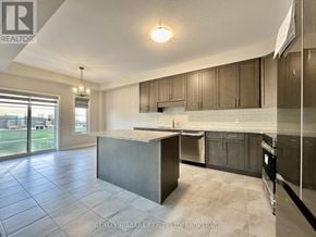 Pelham (Fonthill) townhouse for rent - A kitchen with a large island in the middle.
