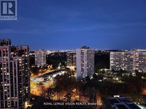 Toronto (Banbury-Don Mills) condo for rent - A cityscape at night with the text "ROYAL LEPAGE VISION REALTY, Brokerage" overlaid on the image.