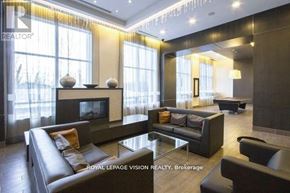Toronto (Banbury-Don Mills) condo for rent - A modern living room with a fireplace and a glass coffee table.