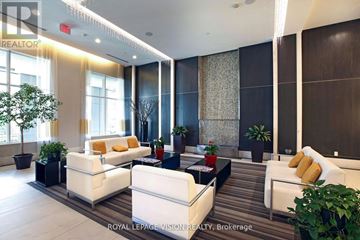 Toronto (Banbury-Don Mills) condo for rent - A living room with white furniture and a large window.