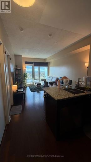 Mississauga (City Centre) condo for rent - A well-lit kitchen with a large island in the middle.