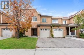 Brampton (Sandringham-Wellington) townhouse for rent - A large brick house with a tree in front of it.