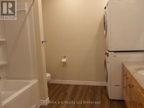 Woodstock (Woodstock - North) apartment for rent - A white washer and dryer in a small laundry room.