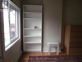 Woodstock (Woodstock - South) apartment for rent - A room with a white shelf, a small white table and a brown rug.